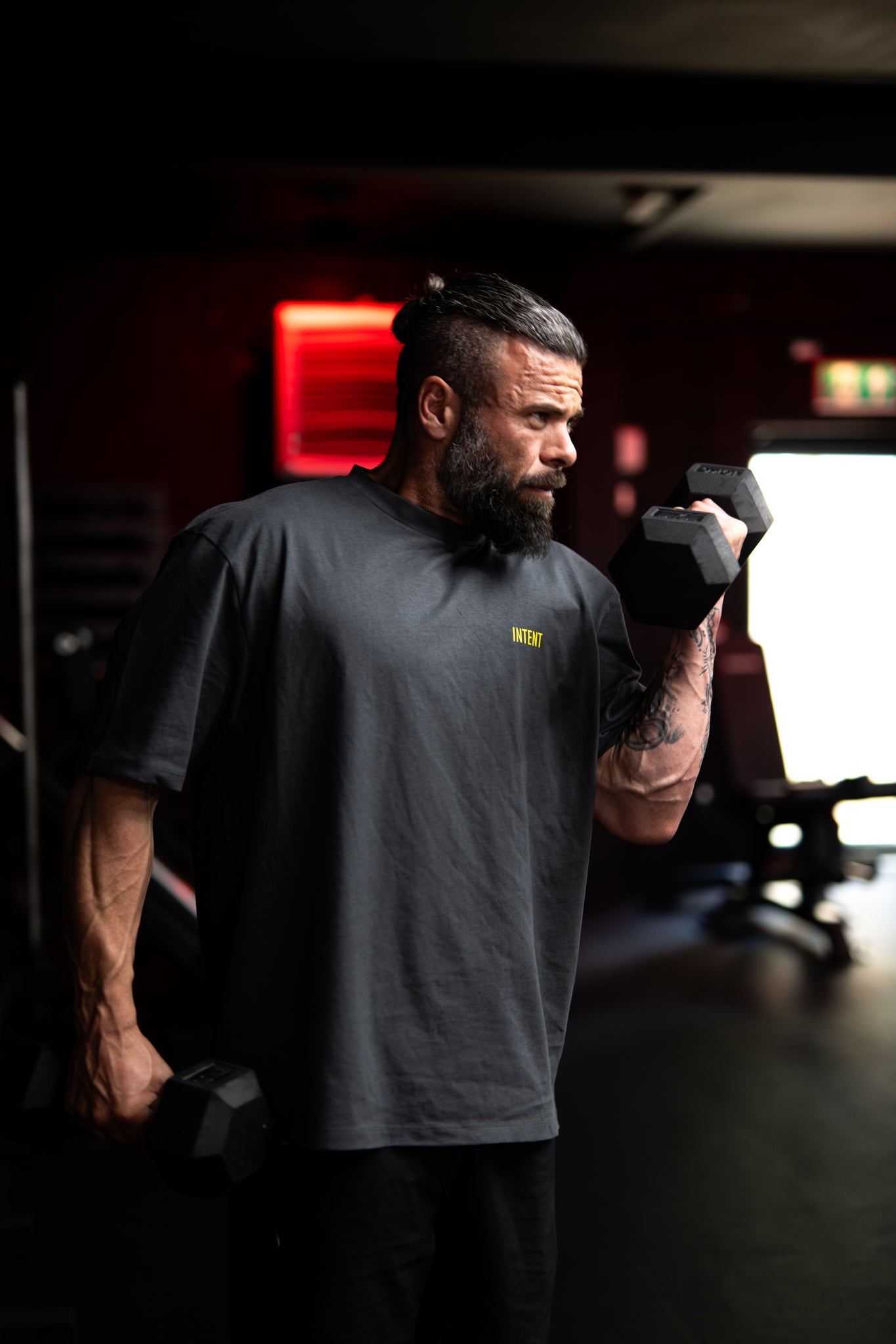 Man lifting weights in a gym setting