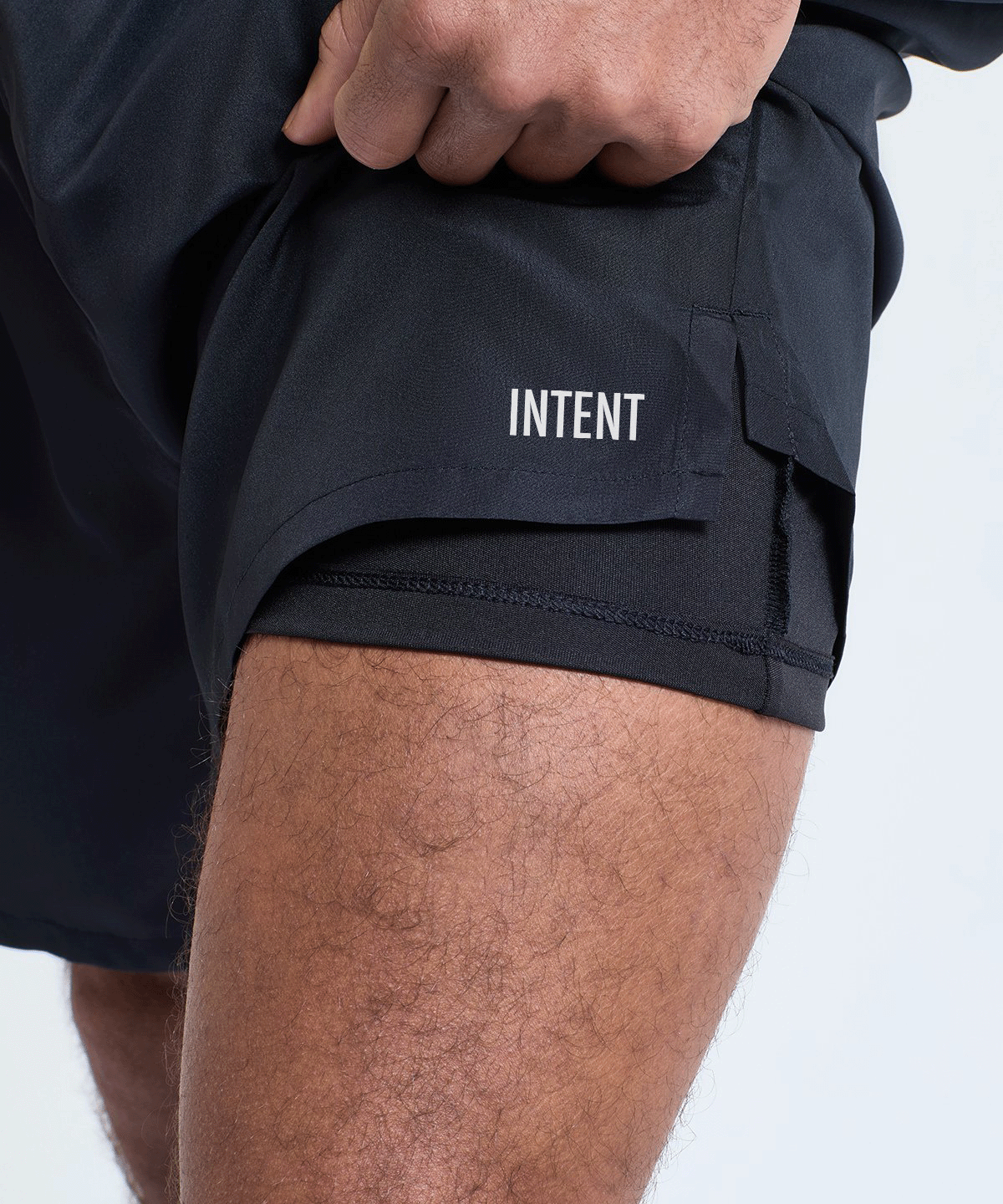 Black shorts with 'Intent' branding on a white background